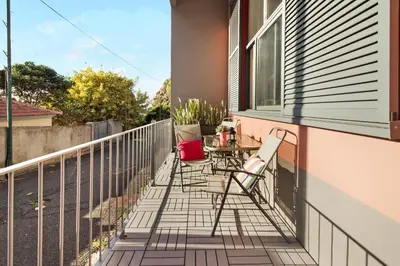 a patio with chairs and a table on a balcony at Calheta Lofts ii in Calheta