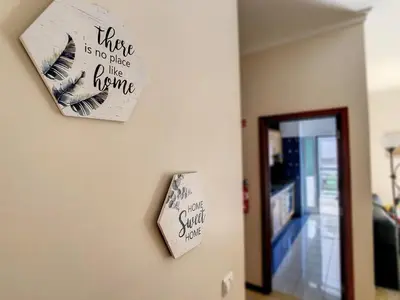 a sign on a wall next to a door at Theos Apartment by LovelyStay in Funchal