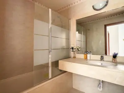 a bathroom with a sink and a shower at Theos Apartment by LovelyStay in Funchal