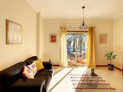 a living room with a couch and a table at Theos Apartment by LovelyStay in Funchal