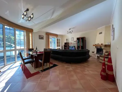 a large living room with a couch and a table at Briola by AnaLodges in São Vicente