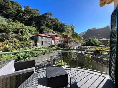 a balcony with a view of a city at Briola by AnaLodges in São Vicente