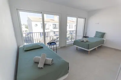 a white laundry room with a washer and dryer at Arrifana Sunset Sea View Villa in Praia da Arrifana