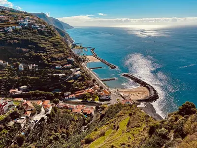 an aerial view of a town on a hill next to the ocean at Vilamar 2 - Madeira Inn Group in Calheta