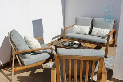 a living room with two chairs and a couch at Mar à Vista Burgau in Burgau