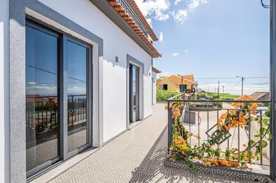 a balcony with a view of the ocean at Canhas Residence I by Homie in Ponta do Sol