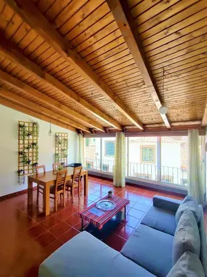 a living room with a couch and a table at Fort Traditional Guest House in Funchal