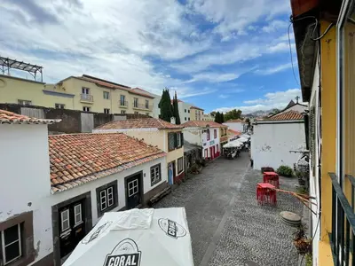 a view of a street in a town with buildings at Fort Traditional Guest House in Funchal