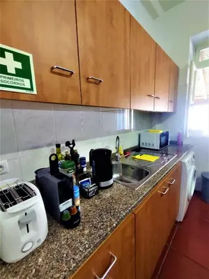 a kitchen with a sink and a counter top at Fort Traditional Guest House in Funchal