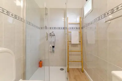 a bathroom with a shower and a toilet at Casa da Hortência do Faial in Faial
