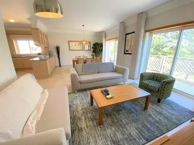 a living room with a couch and a table at Apartamento Boavista in Lagos