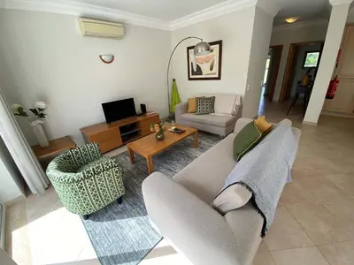 a living room with a couch and a table at Apartamento Boavista in Lagos