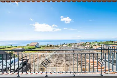 a balcony with a view of the ocean at Canhas Residence II by Homie in Ponta do Sol