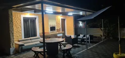 a living room with a couch and a table at Recanto Dourado in Porto Santo