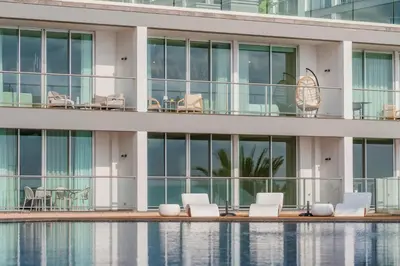 a building with a pool in front of it at Madeira Palace III by An Island Apart in Funchal