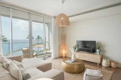 a living room with a couch and a television at Madeira Palace III by An Island Apart in Funchal