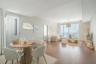 a living room with a table and chairs at Madeira Palace III by An Island Apart in Funchal