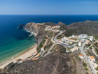 an aerial view of a village on a mountain next to the ocean at Aloha Apartment Arrifana in Praia da Arrifana