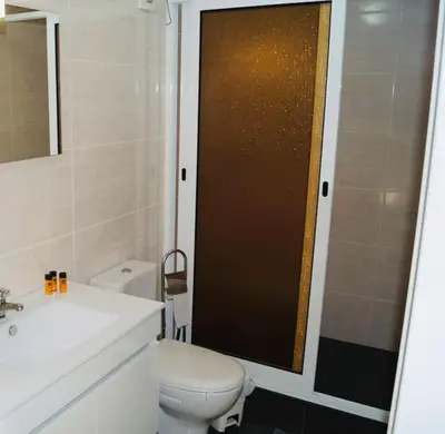 a bathroom with a toilet and a sink and a shower at Casa MaBu by Your Madeira Rentals in Paul do Mar