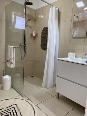 a bathroom with a shower and a sink at Mine House in Calheta