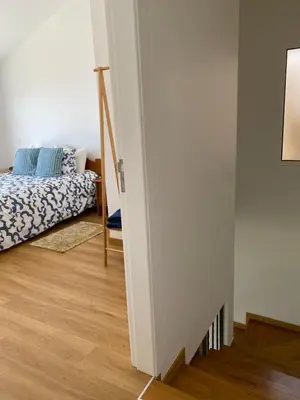a bedroom with a bed and a room with a mirror at Mine House in Calheta