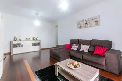 a living room with a couch and a table at Village Lobos Flat in Câmara de Lobos