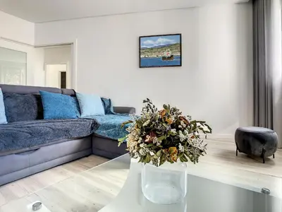 a living room with a couch and a table at Uptown Apartment by LovelyStay in Funchal
