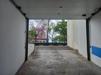 an empty hallway of a building with the door open at Amazing SEA LIGHT Apartment, close to the beach. in Santa Cruz
