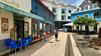 a couple of people walking down a street at Amazing SEA LIGHT Apartment, close to the beach. in Santa Cruz