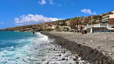 a beach with rocks and the ocean and houses at Amazing SEA LIGHT Apartment, close to the beach. in Santa Cruz