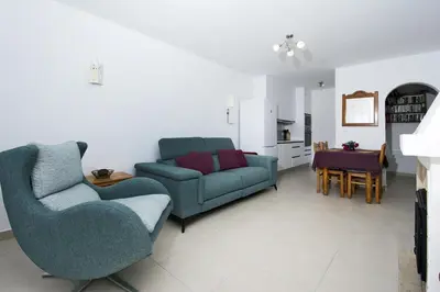 a living room with two chairs and a couch at 413 Casa Marsalema in Salema
