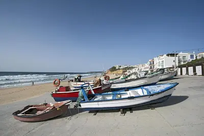 a group of boats parked on the beach at 413 Casa Marsalema in Salema