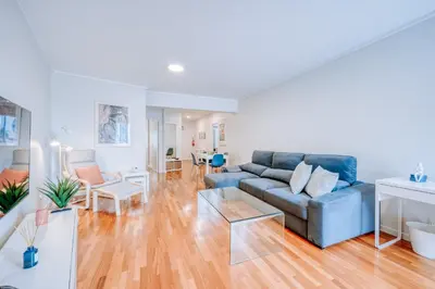 a living room with a couch and a table at Apartamento Feliz by Amazing Madeira in Funchal