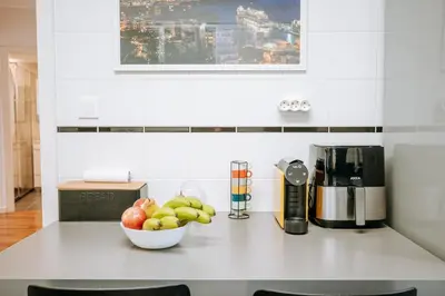 a kitchen counter with a bowl of fruit on it at Apartamento Feliz by Amazing Madeira in Funchal