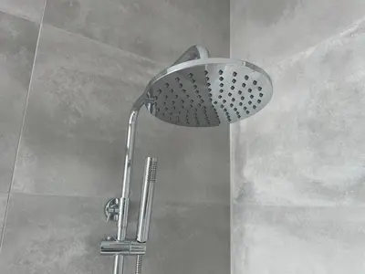 a shower with a shower head in a bathroom at Villa Sea View in Arco da Calheta