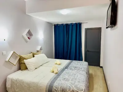 a bedroom with a bed with two teddy bears on it at Alojamento Central I - Funchal in Funchal