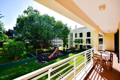 a balcony with a view of a yard at Lido Gardens Funchal in Funchal