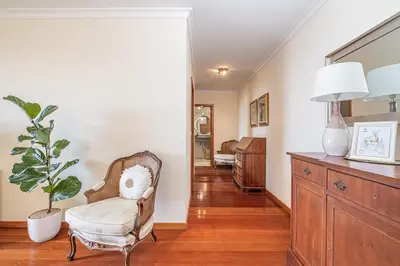 a living room with a chair and a dresser at Bellemar Apartment by Homie in Funchal