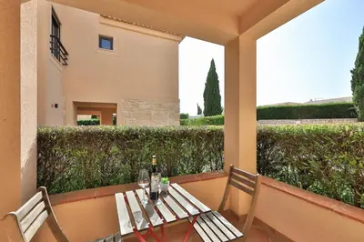a house with two trees in a parking lot at CoolHouses Algarve, Luz 2 bed elegant flat, private pool & garden, SPA facilities, Mar da Luz 19 in Luz