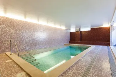 a large swimming pool in a building at CoolHouses Algarve, Luz 2 bed elegant flat, private pool & garden, SPA facilities, Mar da Luz 19 in Luz