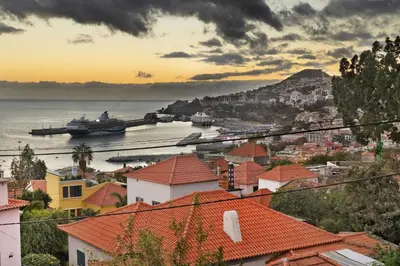 a view of a city with boats in the water at Palheiro Residence Familiar 2 in Funchal