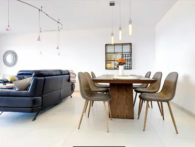a living room with a table and a couch at Apartment Nata by Holiday Rental Madeira in Caniço