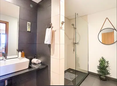 a bathroom with a sink and a shower at Apartment Nata by Holiday Rental Madeira in Caniço