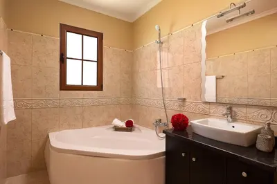 a bathroom with a toilet and a sink at KING´S HOUSE (Sea View and Indoor BBQ) in Estreito da Calheta