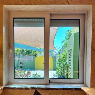 an open window with a view of a yard at Country Villa work&relax in Lagos