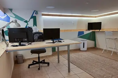 an office with two computer monitors on a desk at Country Villa work&relax in Lagos