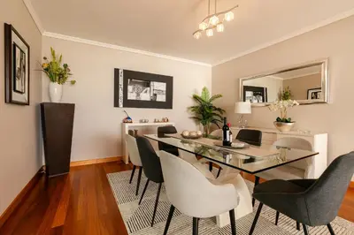 a dining room with a glass table and chairs at Villa Nunes, Big Holiday house with private pool in Calheta