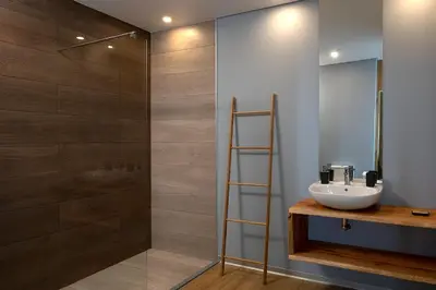 a bathroom with a sink and a shower at King´s View (Heated Pool and Sea View) in Estreito da Calheta