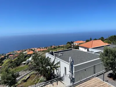 a view of the ocean from the balcony of a house at King´s View (Heated Pool and Sea View) in Estreito da Calheta