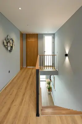 an empty room with a staircase in a house at King´s View (Heated Pool and Sea View) in Estreito da Calheta